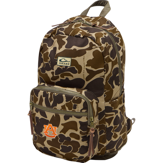Auburn Throwback 80 Backpack with camo print, brass-tone zippers, leather pulls, and embroidered Auburn University logo; durable cotton canvas and suede bottom.