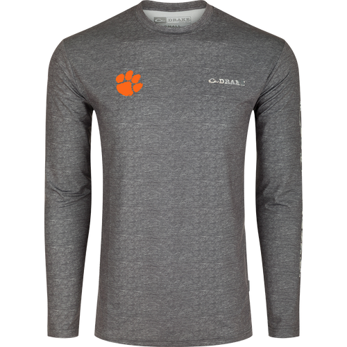 Clemson Performance Heather Long Sleeve Crew: A grey shirt with an orange paw print, designed for exceptional functionality and performance. Lightweight, moisture-wicking, and quick-drying fabric with UPF 50 sun protection. Perfect for all-year wear in various weather conditions.