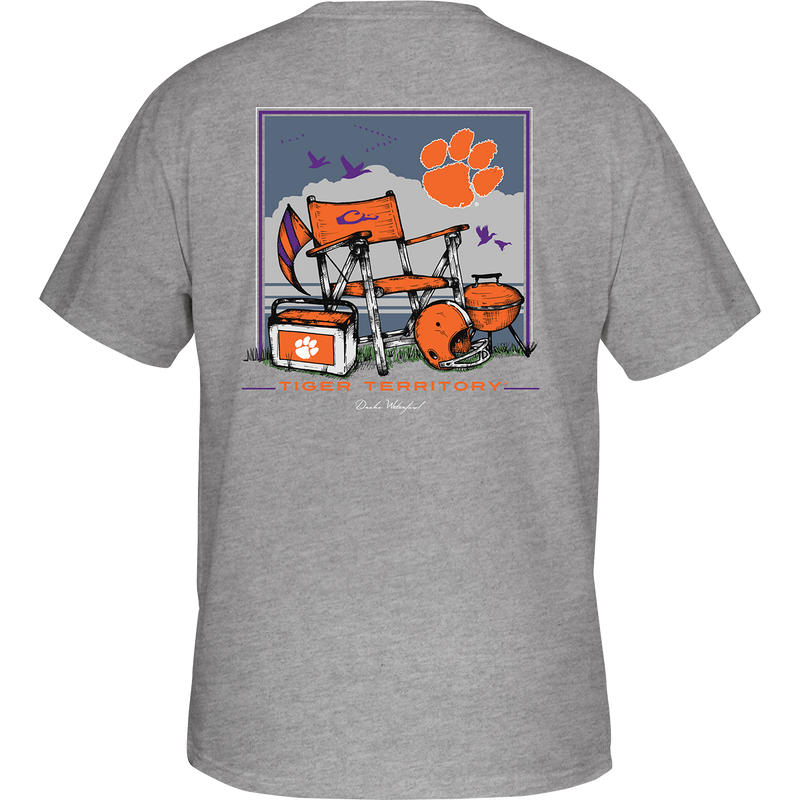 Clemson Beach T-Shirt: Back view of a grey t-shirt with orange and purple designs, featuring a beach scene and school logo. Front showcases school logo on chest pocket.
