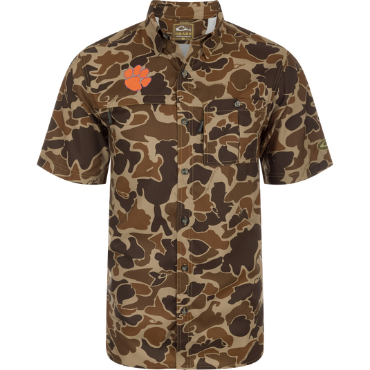 Clemson 8-Shot Short Sleeve Shirt with camouflage pattern, featuring button-down collar, chest pockets, and embroidered paw-print logo, designed for moisture wicking and sun protection.