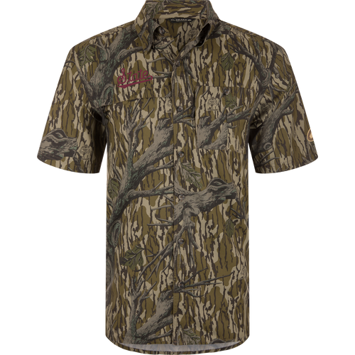 Mississippi State 8-Shot Short Sleeve Shirt with tree-bark camo print, embroidered State logo, chest pockets, and vented cape back, designed for performance and sun protection.