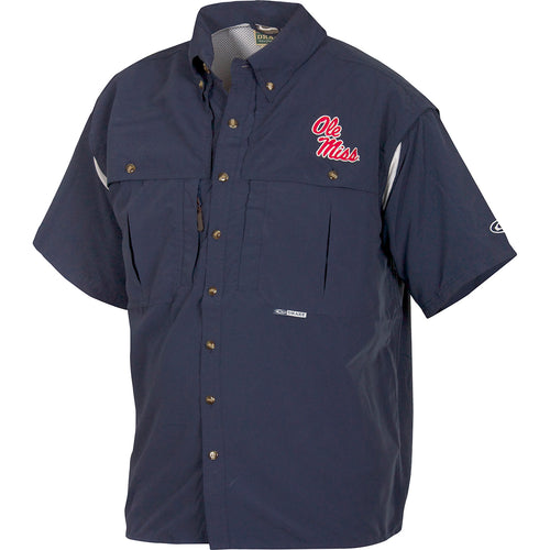 Ole Miss Wingshooter's Shirt Short Sleeve: A blue shirt with a logo, perfect for Game Day. Breathable, cool, and quick-drying. Features front and back ventilation, oversized chest pockets, and a zippered pocket. Made with 100% Polyester twill fabric and Poly-mesh lining in vented areas. From Purewhitelaneshop, high-quality hunting gear and clothing.