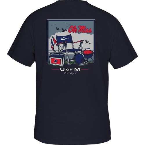 Ole Miss Beach T-Shirt: Back of a t-shirt with a barbecue picture, boat and flag. Chair and helmet on grass, blue and white logo flag, red and white sign with letter M. Red, white, and blue flag. Red text on a blue background. Rectangular box with a letter on it. Blue jacket with a chair and helmet picture. T-shirt with a graphic design.