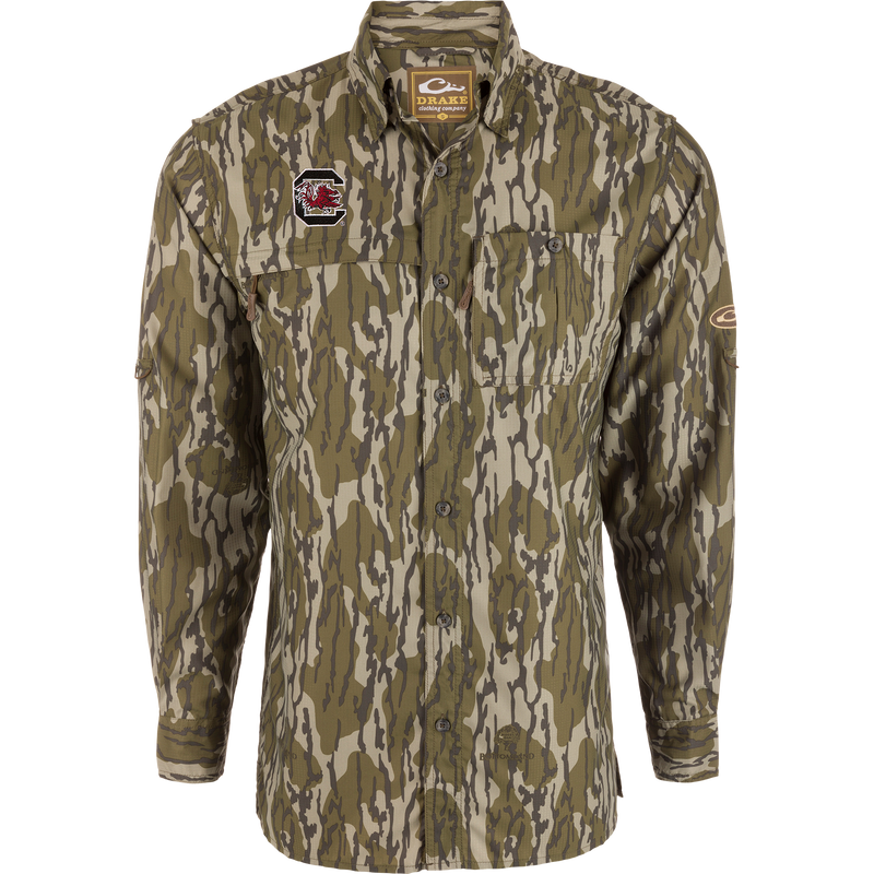 South Carolina 8-Shot Long Sleeve Shirt in camo with Gamecocks patch; features vented cape back, dual chest pockets, hidden zippers, and moisture-wicking fabric.