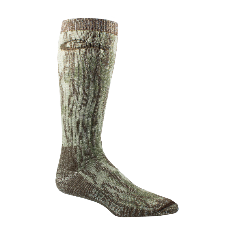 Midweight Merino Camo Mid Calf Hunting Sock featuring a green-brown camouflage pattern, seamless toe, arch support, and DRAKE branding, designed for outdoor performance.