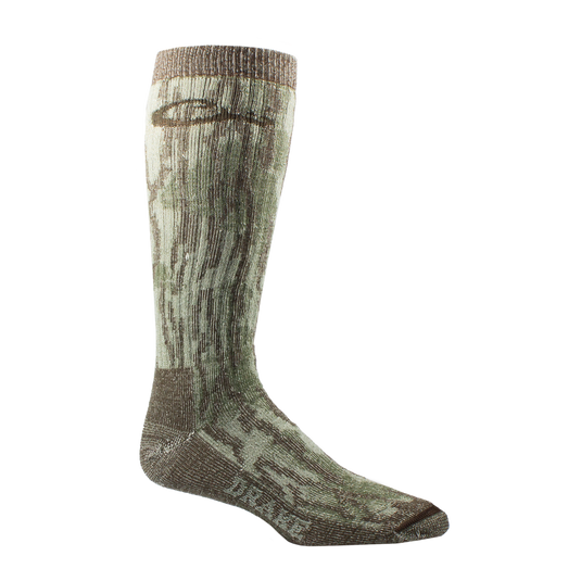 Midweight Merino Camo Mid Calf Hunting Sock featuring a green-brown camouflage pattern, seamless toe, arch support, and DRAKE branding, designed for outdoor performance.