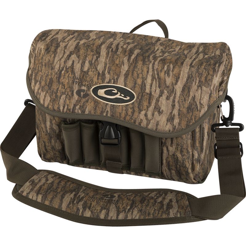 A rugged Refuge Blind Bag by Purewhitelaneshop, ideal for waterfowl hunters. Features adjustable strap, durable hardware, neoprene shell loops, and waterproof materials. Perfect for daily hunting excursions.