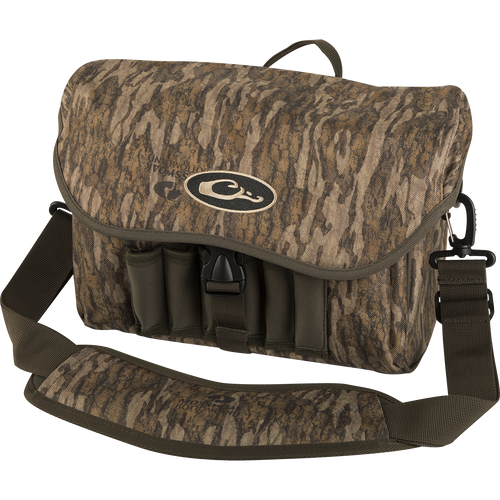 A rugged Refuge Blind Bag by Purewhitelaneshop, ideal for waterfowl hunters. Features adjustable strap, durable hardware, neoprene shell loops, and waterproof materials. Perfect for daily hunting excursions.