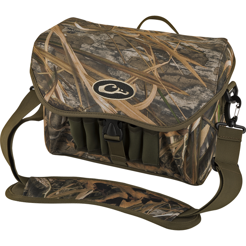 Refuge Blind Bag by Purewhitelaneshop: Camouflage bag with adjustable strap, logo detail, and durable hardware. Ideal for daily waterfowl hunting with improved zipper, outer pocket, and neoprene shell loops.