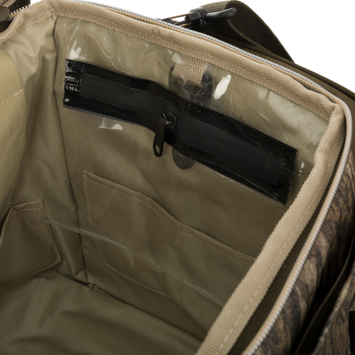 Large Blind Bag with zipper, 18 pockets for organizing gear, waterproof internal compartment, durable construction, adjustable shoulder strap.