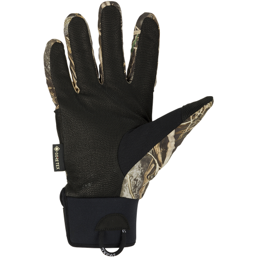 MST Refuge HS GORE-TEX Gloves: A black glove with a camouflage pattern, designed for in-between seasons. Waterproof and breathable for effective field use.