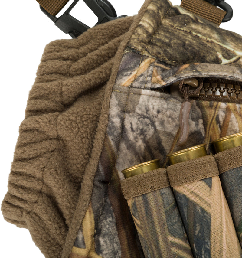 Close-up of the Drake LST Handwarmer Muff, featuring soft fleece lining, front storage pocket, waterproof phone pouch, and clips for wader attachment.