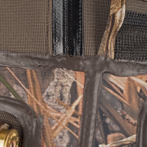A close-up of the Buckshot Eqwader 1600 Neoprene Wader 3.0, showcasing the durable camouflage fabric and waterproof seam technology.