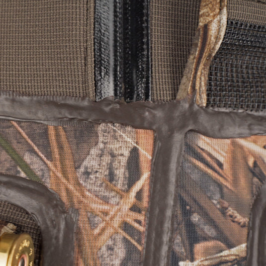 A close-up of the Buckshot Eqwader 1600 Neoprene Wader 3.0, showcasing the durable camouflage fabric and waterproof seam technology.