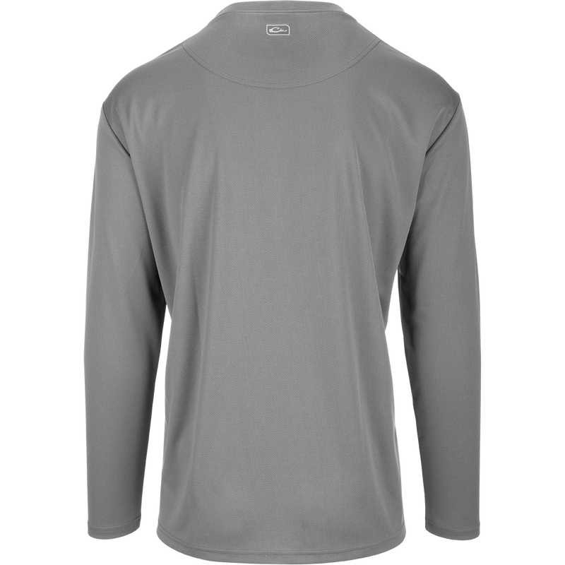 A versatile Performance Mesh Crew shirt with built-in stretch, UPF 50 sun protection, and moisture-wicking fabric. Features thumbholes for added sleeve protection and a square hem for tucking or untucking. Perfect for outdoor enthusiasts.