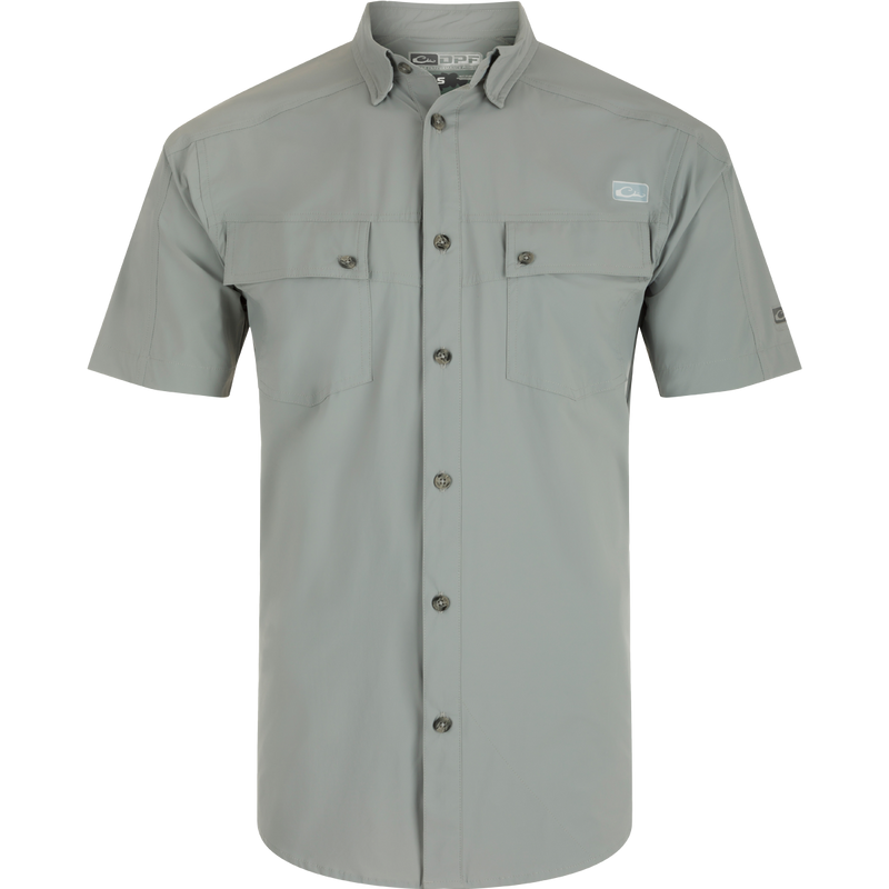 A close-up of the Performance Mesh Paneled Short Sleeve Shirt, featuring a button-down collar, laser-punched mesh back panels for ventilation, and two chest pockets. Lightweight, moisture-wicking fabric with UPF 50 sun protection.