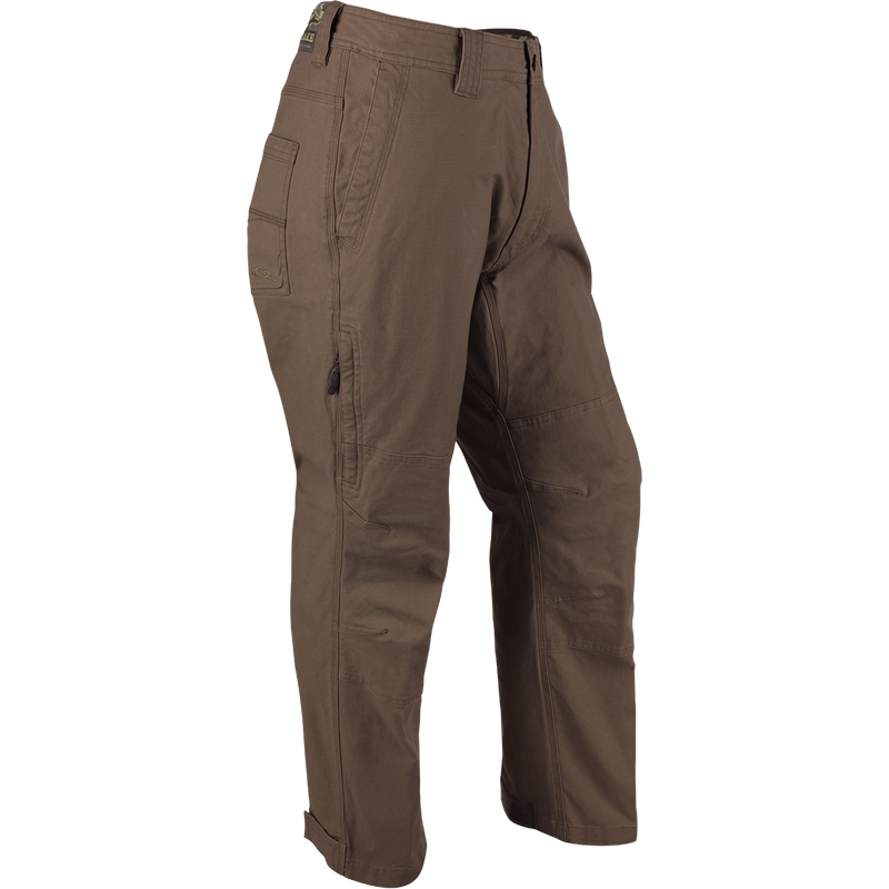Olive Canvas Waterfowler's Pant: Lightweight cotton canvas pant for under-wader or casual wear. Garment-washed for softness. Features include  ankle cuffs, rear pockets, side storage pocket, and zippered fly.