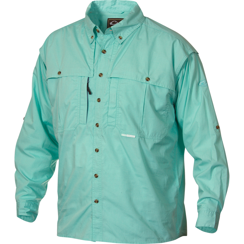 A light blue Wingshooter's shirt with buttons, made of StayCool™ cotton blend fabric. Features include front and back ventilation, oversized chest pockets, and a vertical zippered pocket. Perfect for outdoor activities or casual office wear.