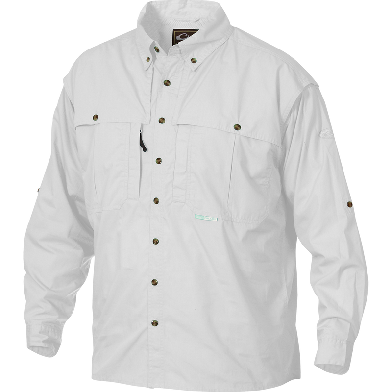 A white Wingshooter's shirt with buttons, made of StayCool™ cotton blend fabric. Features front and back ventilation, oversized chest pockets, and a vertical zippered pocket. Perfect for outdoor activities or casual office wear.