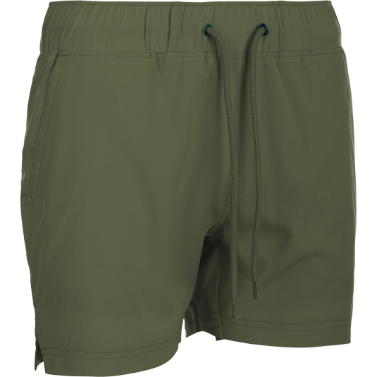 A versatile pair of green shorts with a built-in liner. Made with 88% polyester and 12% spandex for 4-way stretch. Features include front slash pockets, back pockets with closures, and a 4.5" inseam. Perfect for the gym or beach. From the Purewhitelaneshop store.
