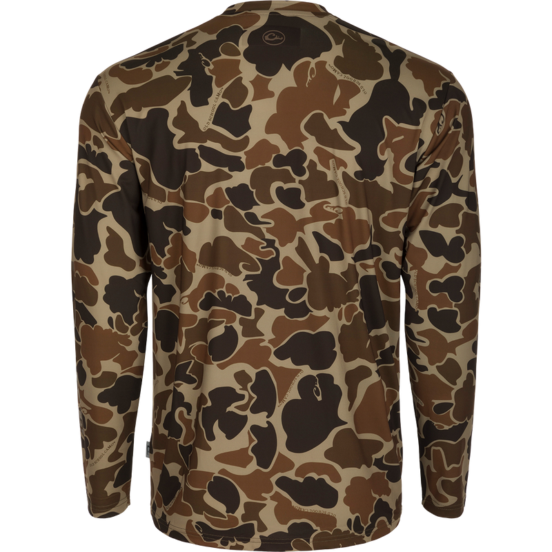 Youth Performance Crew L/S: A camouflage shirt with a logo, made of lightweight, breathable fabric. Features include cooling, moisture-wicking, and quick-drying properties. UPF 50 provides sun protection. Ideal for hunting and outdoor activities.