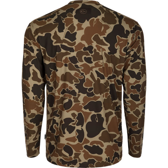 Youth Performance Crew L/S: A camouflage shirt with a logo, made of lightweight, breathable fabric. Features include cooling, moisture-wicking, and quick-drying properties. UPF 50 provides sun protection. Ideal for hunting and outdoor activities.