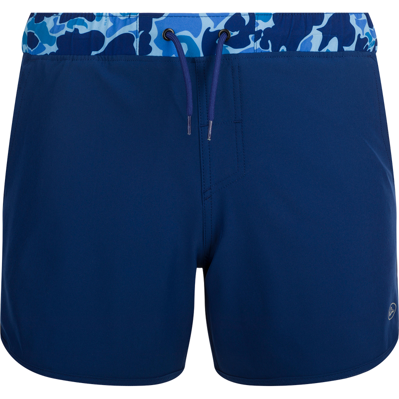 A versatile blue and white swim short with a camo print, featuring a built-in liner, scalloped hem, and multiple pockets. Ideal for playground or beach wear.