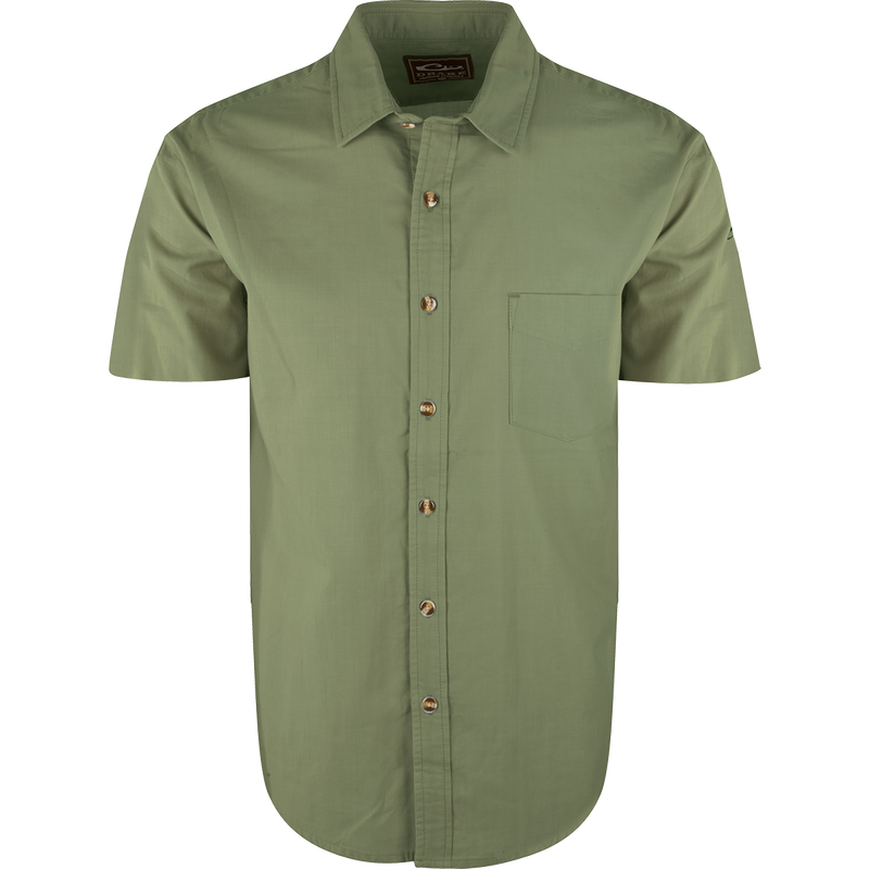 A green button-up shirt with soft-washed cotton comfort. Untucked styling and left chest pocket. Perfect for casual wear or pairing with Drake outerwear.