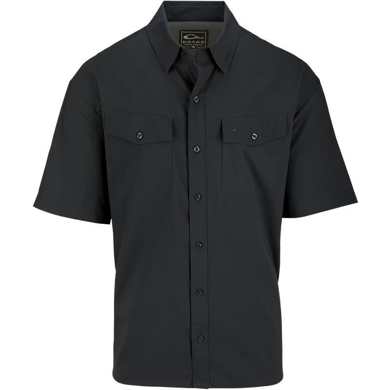 A black button-up shirt with hidden collar buttons, chest pockets, and a split tail hem. Made from 100% Polyester dobby fabric, it offers UPF30 sun protection and moisture-wicking properties. Versatile for any occasion. From Purewhitelaneshop, high-quality hunting gear and clothing.