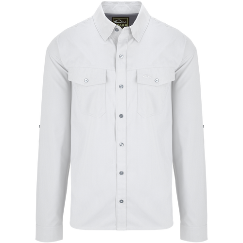 Traveler's Solid Dobby Shirt L/S: A white shirt with long sleeves, hidden button-down collar, and two chest pockets with button-through flaps. Classic fit, versatile for any season.