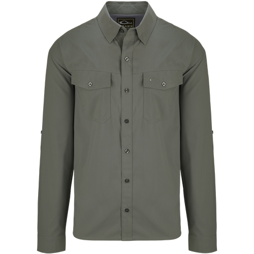 Traveler's Solid Dobby Shirt L/S: A classic fit, long-sleeved shirt with hidden button-down collar, chest pockets, and split tail hem. Made of featherweight, moisture-wicking fabric with UPF30 sun protection.