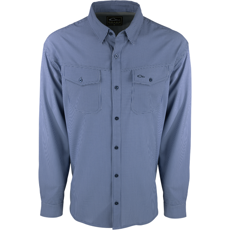 A lightweight, wrinkle-resistant Traveler's Check Shirt L/S with four-way stretch for freedom of movement. Moisture-wicking and breathable, perfect for the man on the go. Two chest pockets with button flaps.