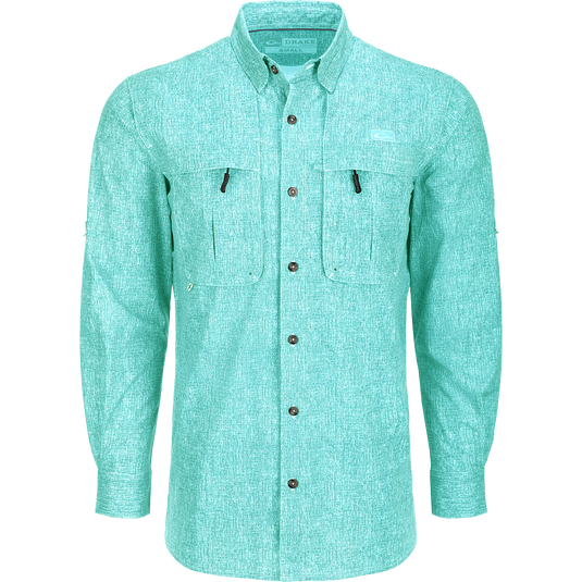 Heritage Heather Shirt L/S: A performance shirt with buttons, pockets, and adjustable roll-up sleeves. Made of lightweight, moisture-wicking polyester micro mesh for natural cooling and quick drying. Features UPF30 sun protection, hidden button-down collar, vented cape back, and split tail hem. Ideal for outdoor activities or office wear.