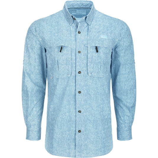 A close-up of the Heritage Heather Shirt L/S, a long-sleeved blue shirt with hidden button-down collar, vented cape back, and two front chest pockets. Lightweight, moisture-wicking, and quick-drying fabric with UPF30 sun protection. Perfect for performance on the water or at the office.