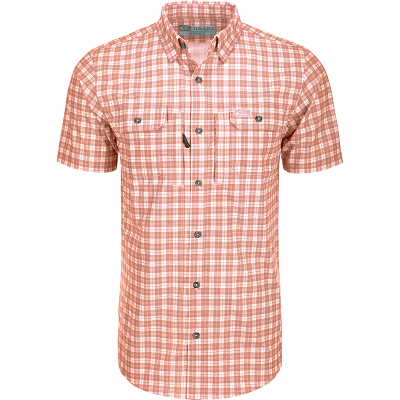 A red and white plaid shirt with hidden button-down collar, vented back cape, and two chest pockets. Lightweight and moisture-wicking for comfort.
