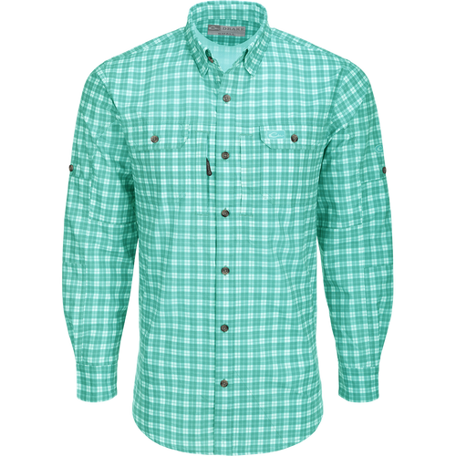 Hunter Creek Check Plaid Shirt L/S: A lightweight, moisture-wicking shirt with micro-mesh for natural cooling. Features include UPF 30 sun protection, hidden button-down collar, and vented back cape. Two chest pockets with Magnattach and zipper closures. Sculpted hem with built-in sunglass wipe. Adjustable roll-up sleeves. High performance and functional for hunting and outdoor activities.