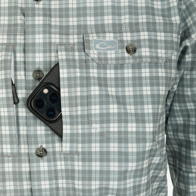 Hunter Creek Check Plaid Long Sleeve Shirt in a pocket, highlighting its functional design with button-down collar and utility pockets, ideal for outdoor activities.