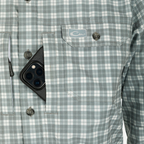Hunter Creek Check Plaid Long Sleeve Shirt in a pocket, highlighting its functional design with button-down collar and utility pockets, ideal for outdoor activities.