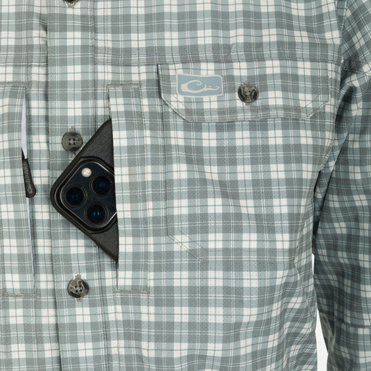 Hunter Creek Check Plaid Long Sleeve Shirt in a pocket, highlighting its functional design with button-down collar and utility pockets, ideal for outdoor activities.