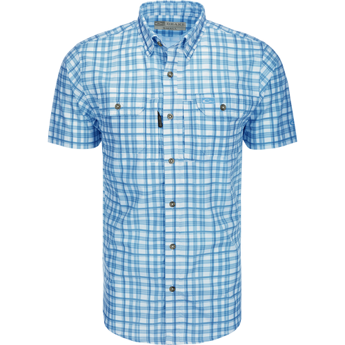 Hunter Creek Window Pane Plaid Shirt S/S: A lightweight, moisture-wicking shirt with UPF30 sun protection. Features a hidden button-down collar, vented back cape, and two chest pockets with Magnattach and zipper closures. Sculpted hem with built-in sunglass wipe.