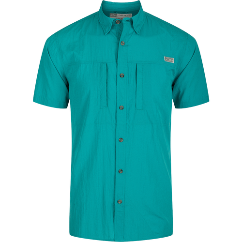 Classic Seersucker Minicheck Shirt: A close-up of a green shirt with buttons, featuring a hidden button-down collar and a zippered chest pocket.