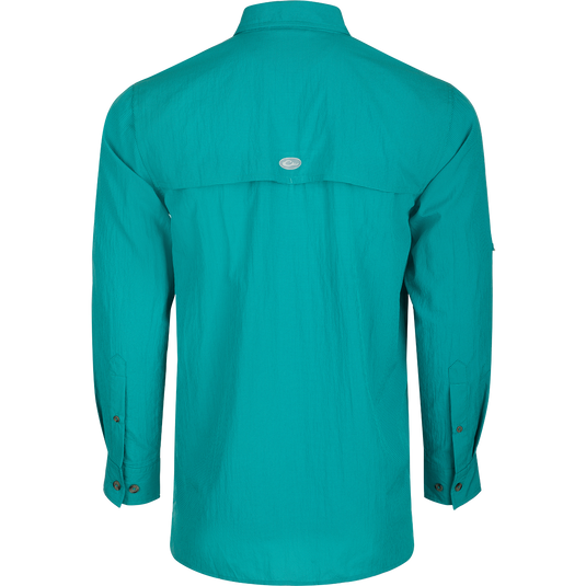 Classic Seersucker Minicheck Shirt L/S: A close-up of a blue shirt with a hidden zippered chest pocket and a Magnattach™ closure on the other pocket.