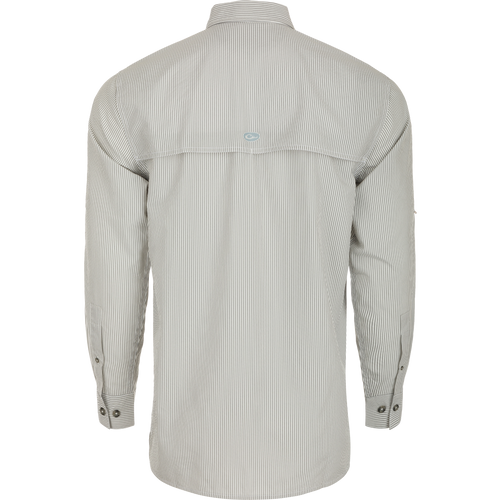Close-up of the Drake Classic Seersucker Stripe Shirt, a soft and featherweight performance shirt with UPF30 sun protection, moisture-wicking fabric, and a hidden zippered chest pocket. Classic fit with a button-down collar and vented cape back. Perfect for hunting and outdoor activities.