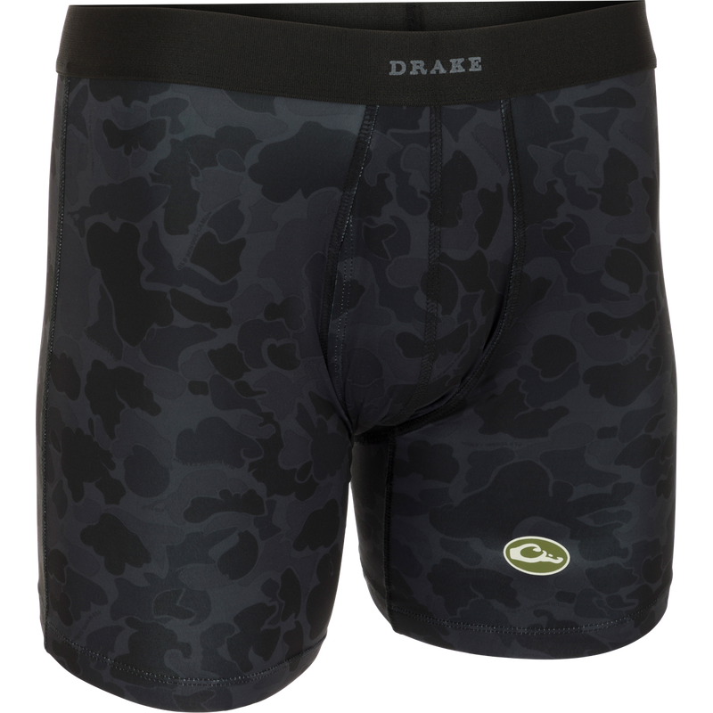 A close-up of the Commando Boxer Brief, a black camouflage underwear with a functional fly and elastic waistband. Made with moisture-wicking fabric and four-way stretch for total freedom of movement.