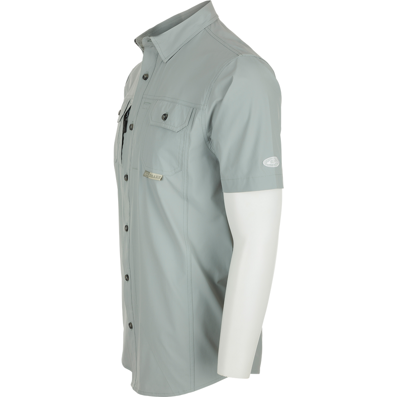 Sideview of Quarry Wingshooter Trey Shirt S/S on mannequin, showcasing hidden collar, chest pockets, and vented back for comfort and style.