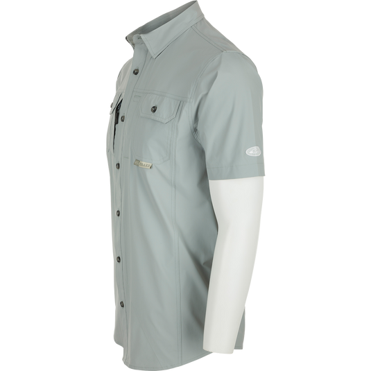 Sideview of Quarry Wingshooter Trey Shirt S/S on mannequin, showcasing hidden collar, chest pockets, and vented back for comfort and style.