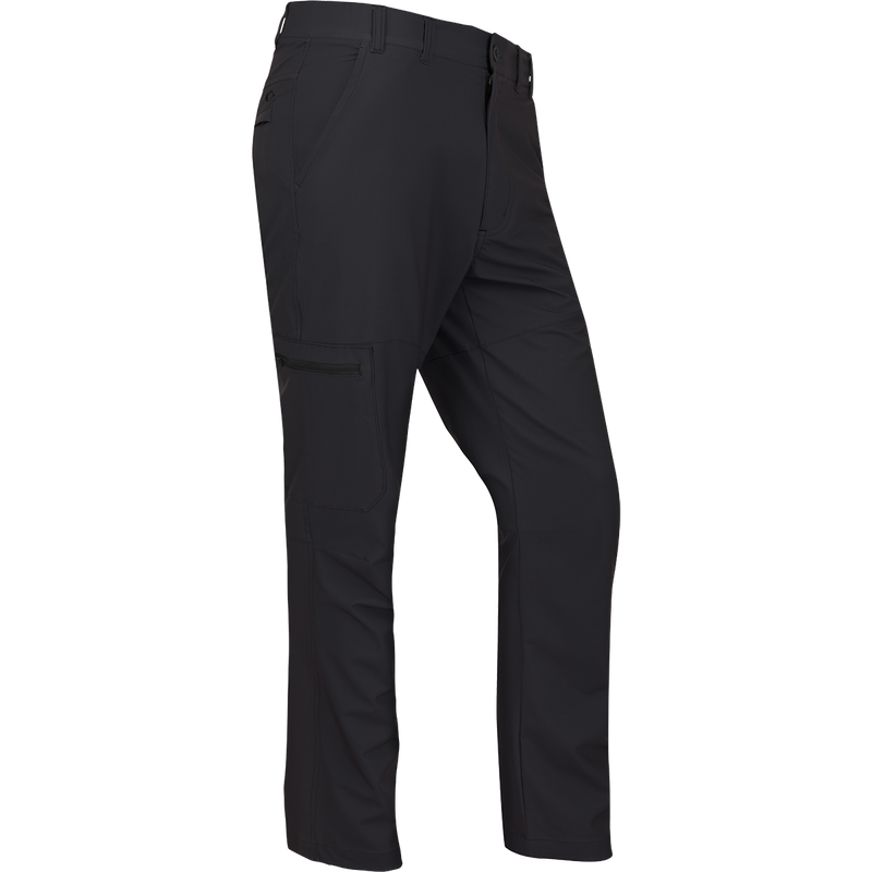 A rugged and sophisticated black Traveler Trek Pant with built-in stretch, moisture-wicking, and quick-drying features. Lightweight and comfortable, with articulated knees, front and back pockets, and a cargo pocket. Perfect for your next adventure.