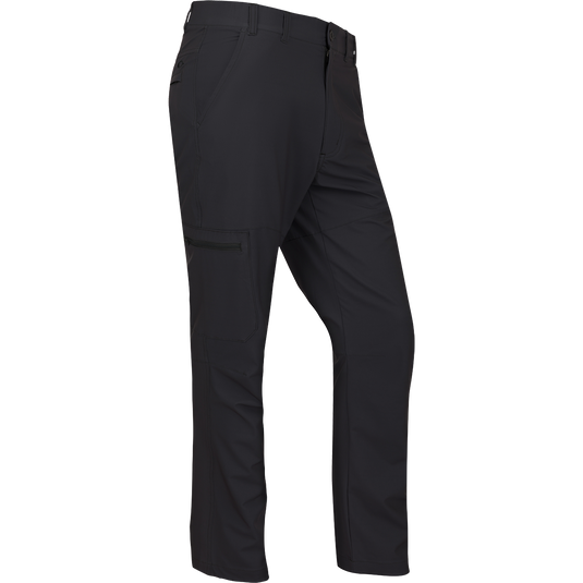 A rugged and sophisticated black Traveler Trek Pant with built-in stretch, moisture-wicking, and quick-drying features. Lightweight and comfortable, with articulated knees, front and back pockets, and a cargo pocket. Perfect for your next adventure.