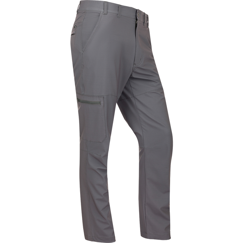 A pair of lightweight, straight leg Traveler Trek Pants with built-in stretch and moisture-wicking fabric. Features include elastic side waist, front slash pockets, and hidden zippered back pockets. Perfect for your next adventure.