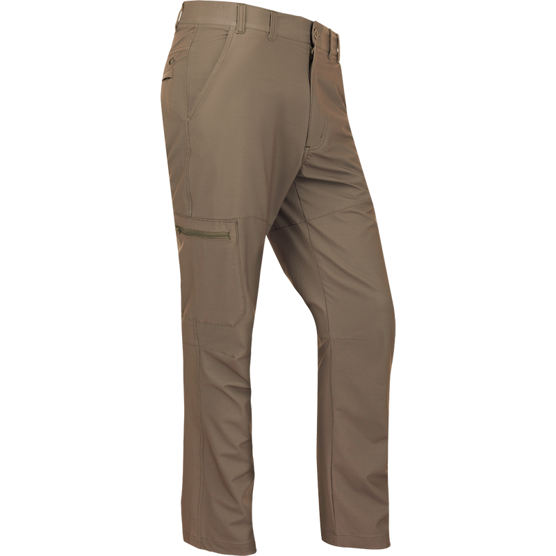 A pair of lightweight, quick-drying Traveler Trek Pants with built-in stretch. Features include articulated knees, front and back pockets, and a zippered cargo pocket. Perfect for your next adventure.